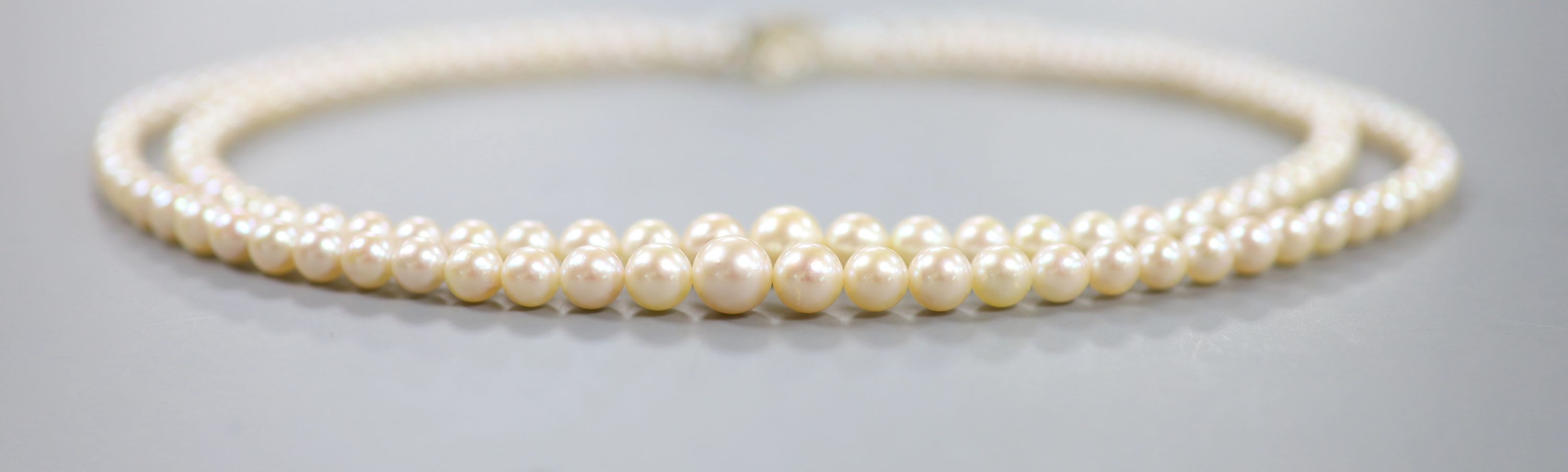 A double strand graduated cultured pearl necklace, with 9ct gold and cultured pearl set clasp, approx. 40cm.